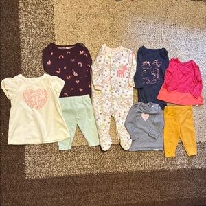 Assorted set of shirts, sleeper and pants.